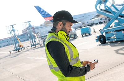 Airport professional using critical push-to-talk communications