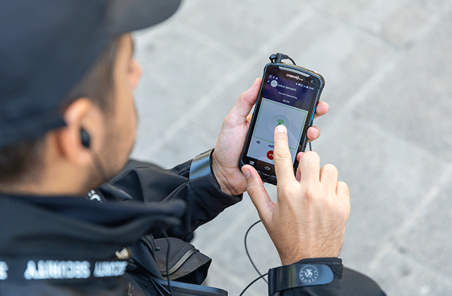 Security person using a mission-critical smartphone