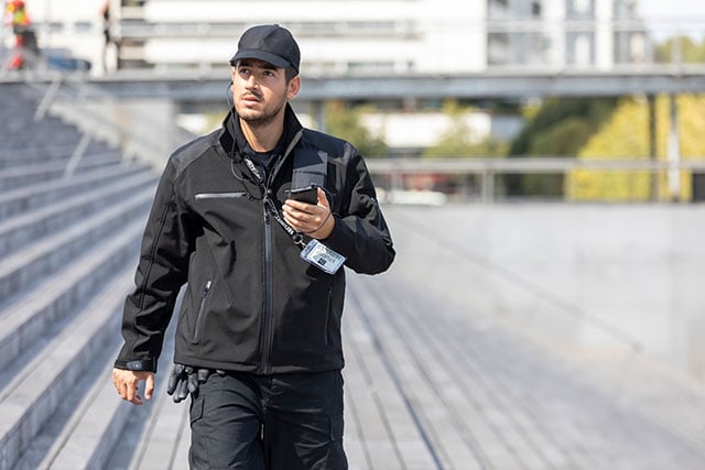 Security person with mission-critical smartphone