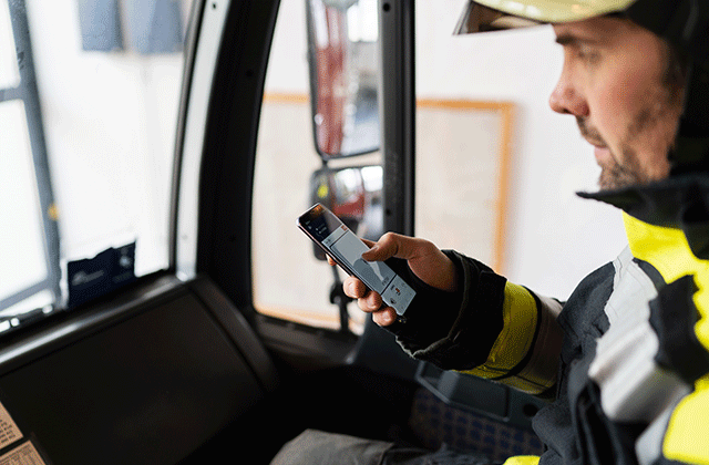 Fireman communicating with a smartphone