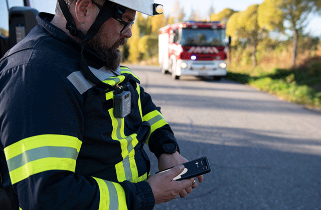 Finnish fireman using a smartphone
