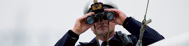 Coast-guard-with-binoculars-610x150px