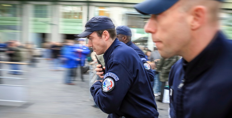 French police running at a railway station