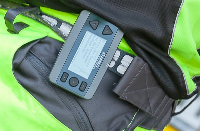 Active TETRA pager on a belt in a holder