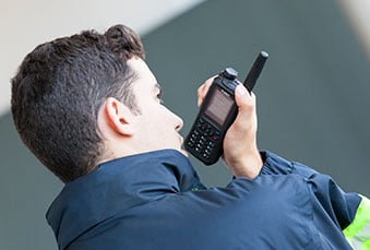 Security person carrying a TH9 TETRA radio