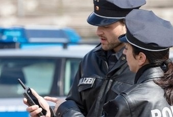 Two-police-officers-looking-at-Tactilon-Dabat-display-339x229