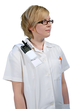 A nurse carrying a TH1n TETRA radio