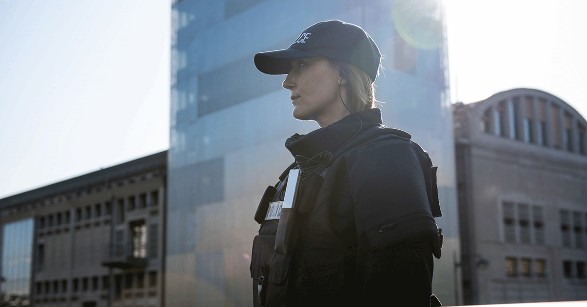 Police-officer-woman-carrying-smarphone_1200x627